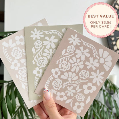 Three floral-patterned cards held by a hand with a plant in the background, featuring a 'Best Value' badge.