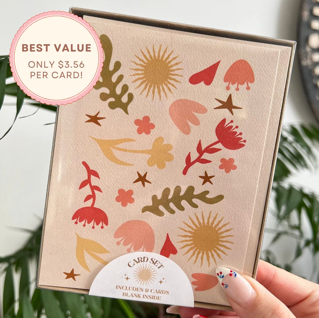 Card set with floral designs held by a hand, with a promotional badge indicating best value.