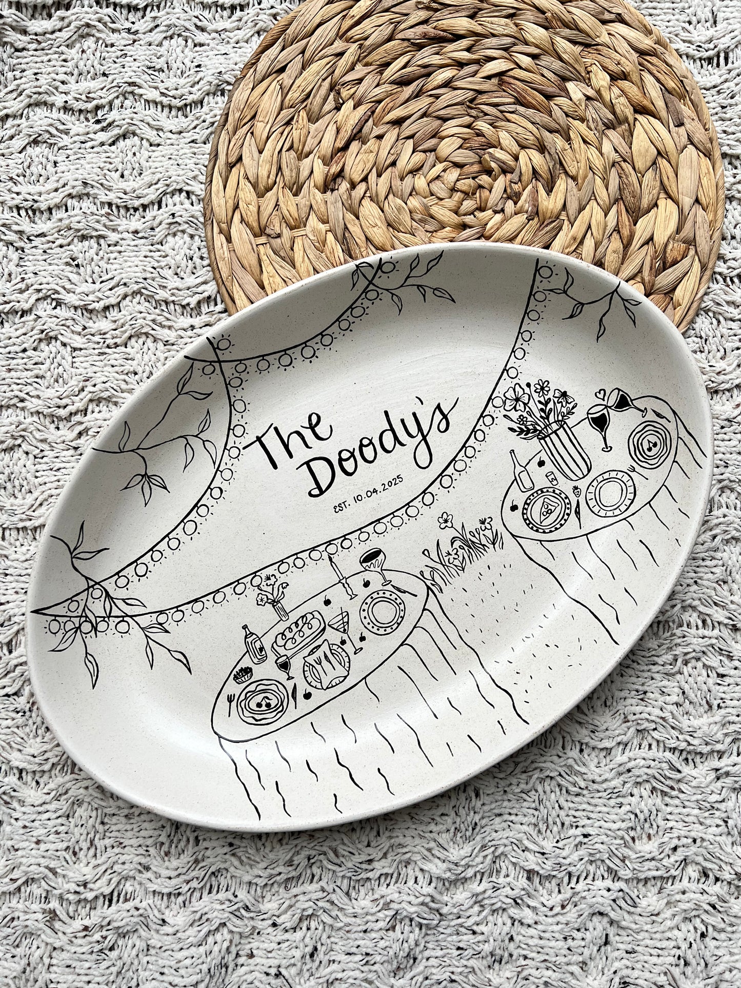 Decorative ceramic tray with artistic design on a textured surface