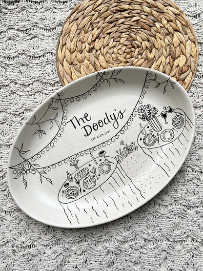 Decorative ceramic tray with artistic design on a textured surface