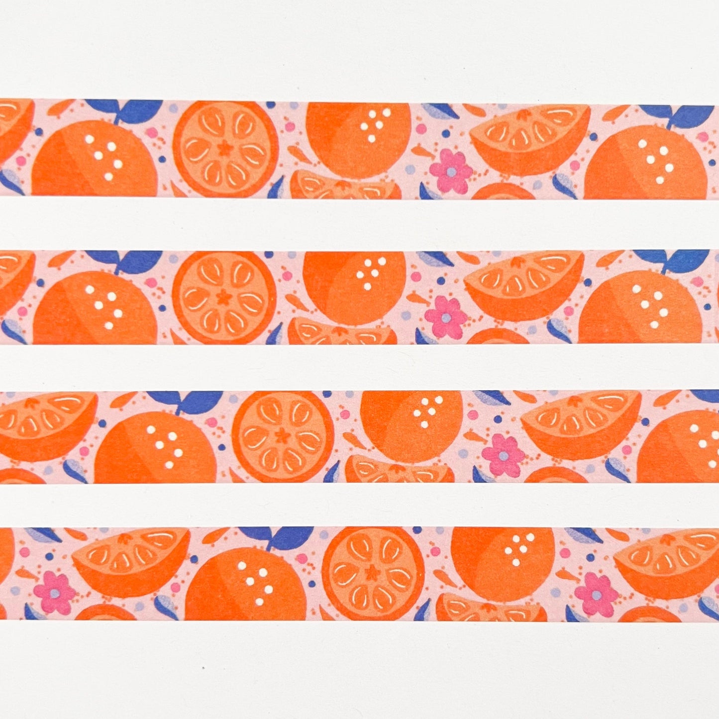 Pattern of orange slices and flowers on a white background