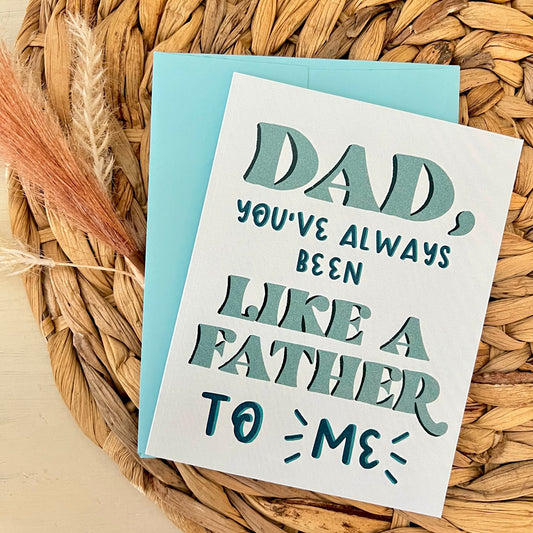 Blue card with text 'Dad, you've always been like a father to me' on a woven mat