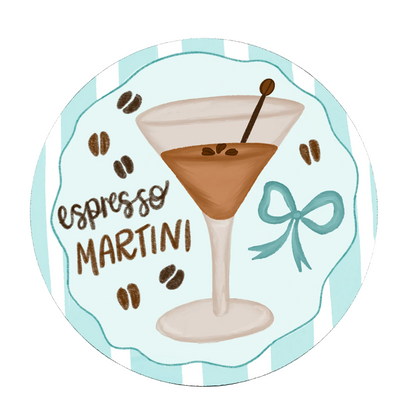 Coaster with an illustration of an espresso martini, coffee beans, and a bow on a light blue background.