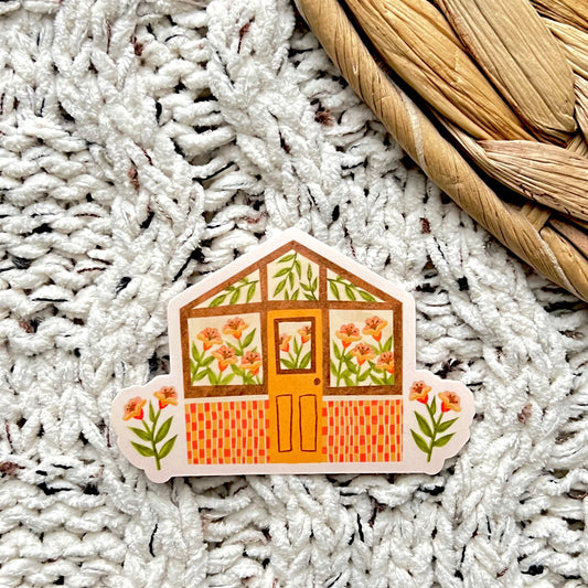 Decorative sticker of a house with floral design on a textured surface