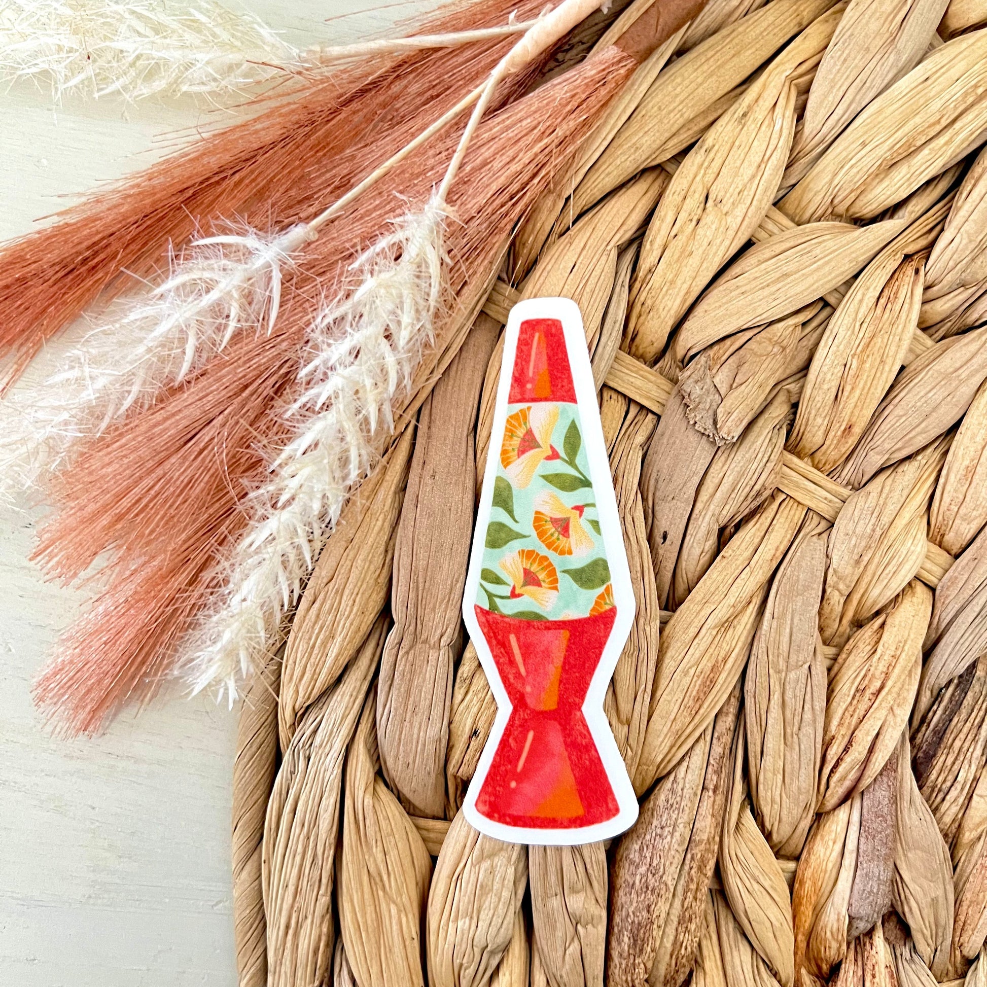 Lava lamp-shaped sticker on a woven surface 