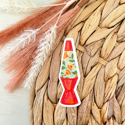 Lava lamp-shaped sticker on a woven surface 