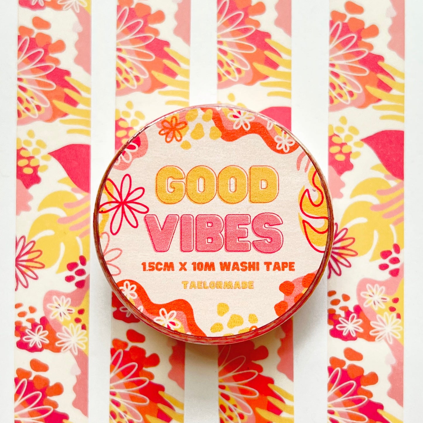 Decorative washi tape with 'Good Vibes' text on a colorful patterned background