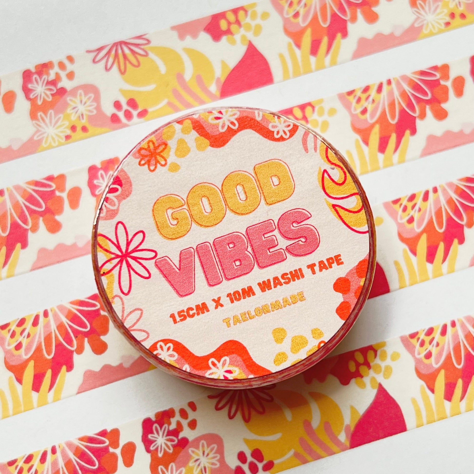 Washi tape with 'Good Vibes' text on a colorful floral background