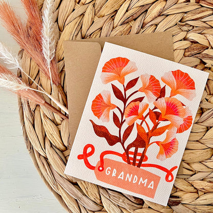 Greeting card with floral design and 'Grandma' text on a woven surface