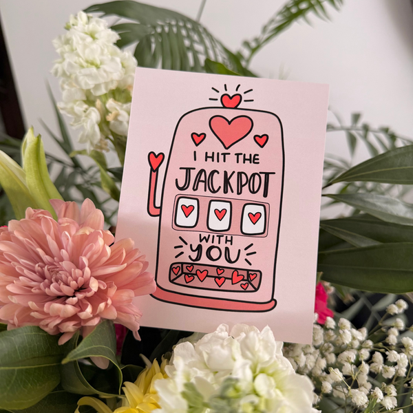 Card with 'I hit the jackpot with you' text surrounded by flowers