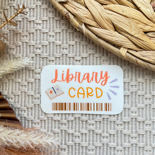 Library card sticker on a textured surface with decorative elements