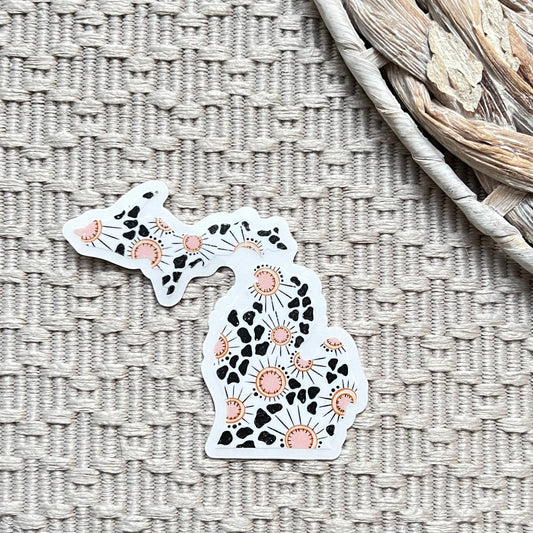 Decorative sticker shaped the state of Michigan on a textured surface