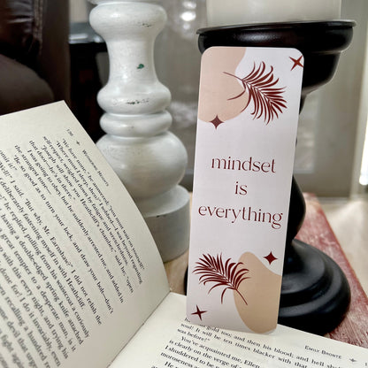 Book with a 'mindset is everything' bookmark on a table