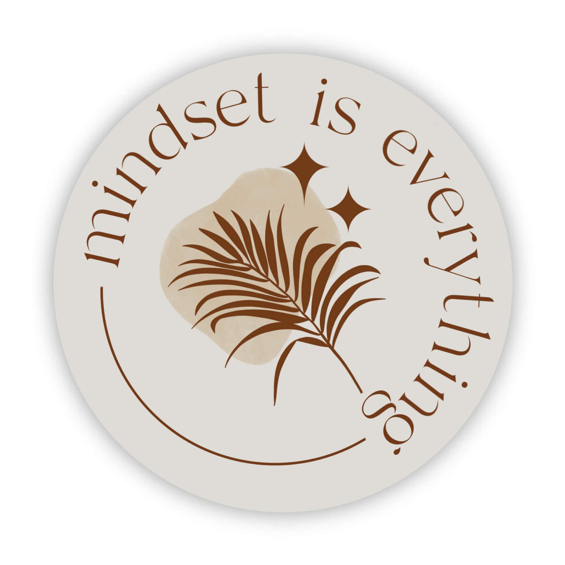 Round sticker with brown leave illustration and 'mindset is everything' text on a white background