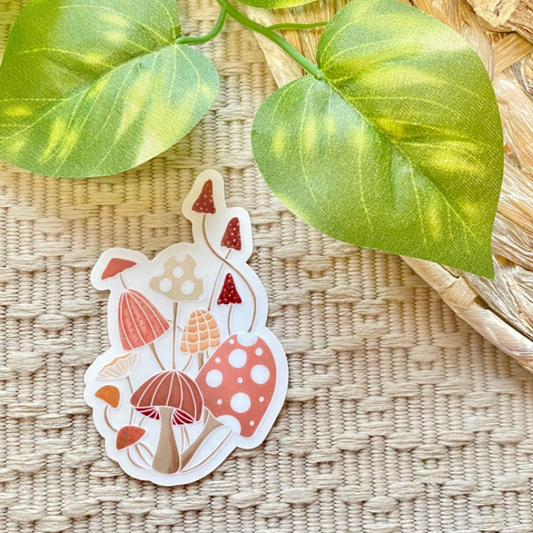 Sticker with mushroom design on a woven surface with leaves