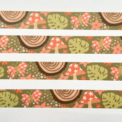 Three strips of decorative washi tape with a nature-themed pattern featuring mushrooms and leaves on a white background.