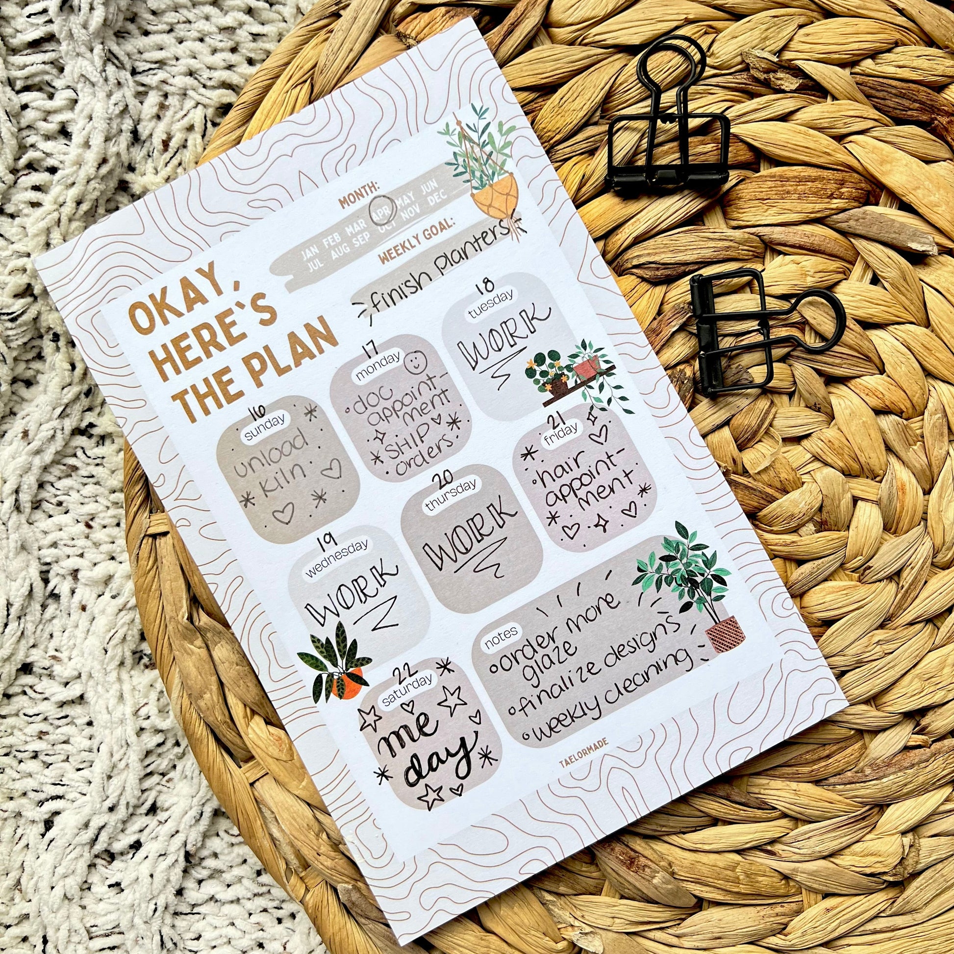 Notepad weekly planner on a woven mat