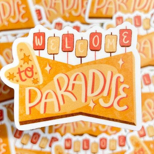 Sticker with 'Welcome to Paradise' text on a patterned background