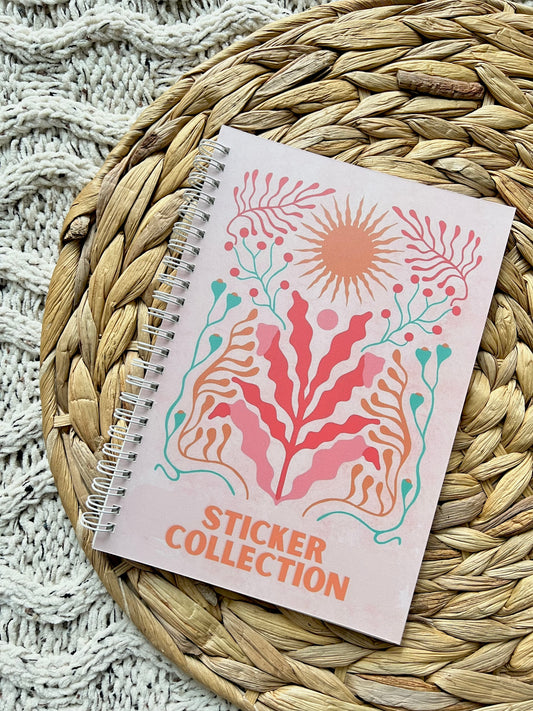 Sticker collection book with floral design on a woven mat