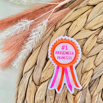 Sticker with 'Number 1 Passenger Princess' text on a woven mat