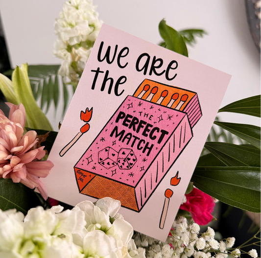 Card with 'We are the perfect match' text surrounded by flowers