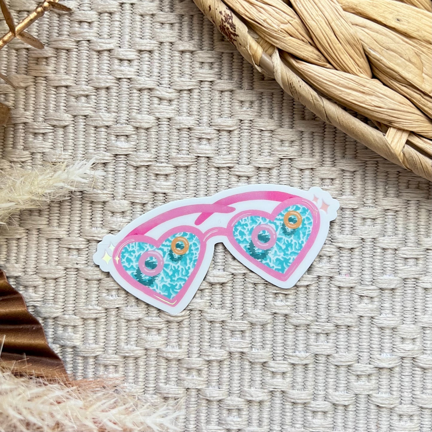 Sticker of sunglasses with pool design on a woven surface