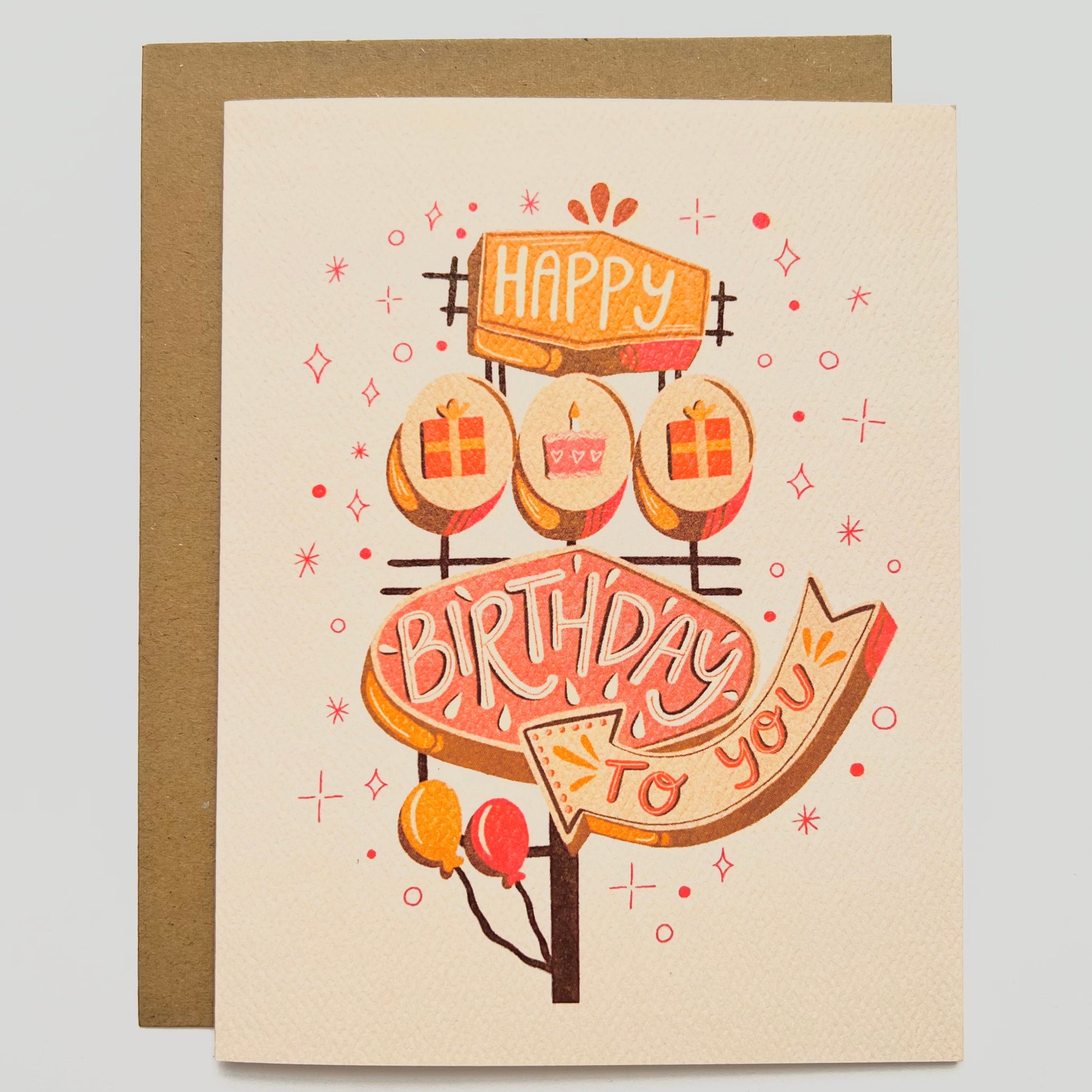 Birthday card with illustration of retro sign saying "happy birthday to you" on a beige background
