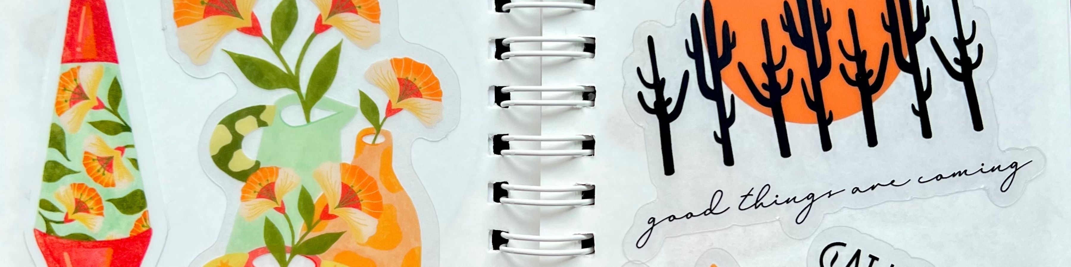 Planner with floral sticker on left and motivational quote on right