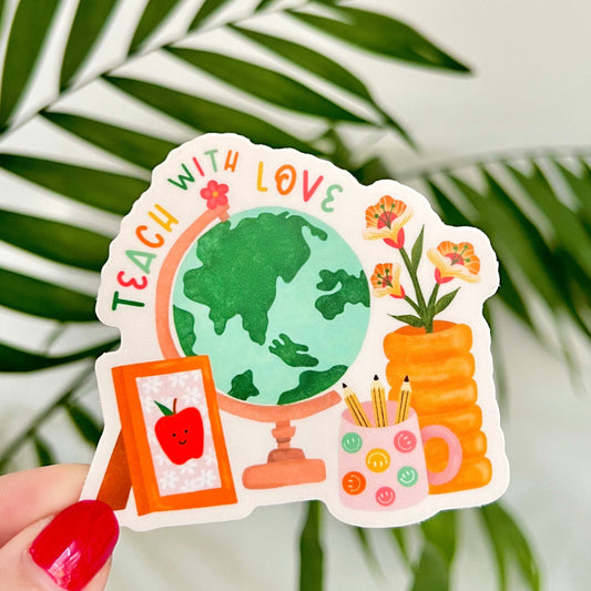 Sticker with educational design held by a hand against a leafy background